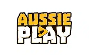 A logo for Aussie Play casino, featuring the text “AUSSIE PLAY” with the word “AUSSIE” in bold, stylized yellow letters and the word “PLAY” in white letters with a yellow outline, all arranged with a playful, bold font style. There is a small triangular play button within the letter “A” of the word “PLAY,” emphasizing the entertainment aspect of the brand. The background is white.